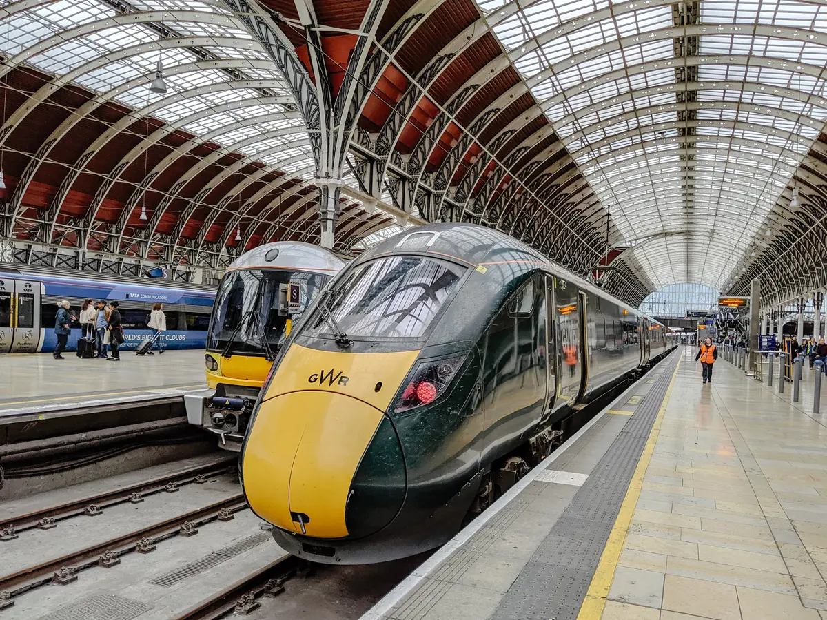 A train pulled up to a busy station 