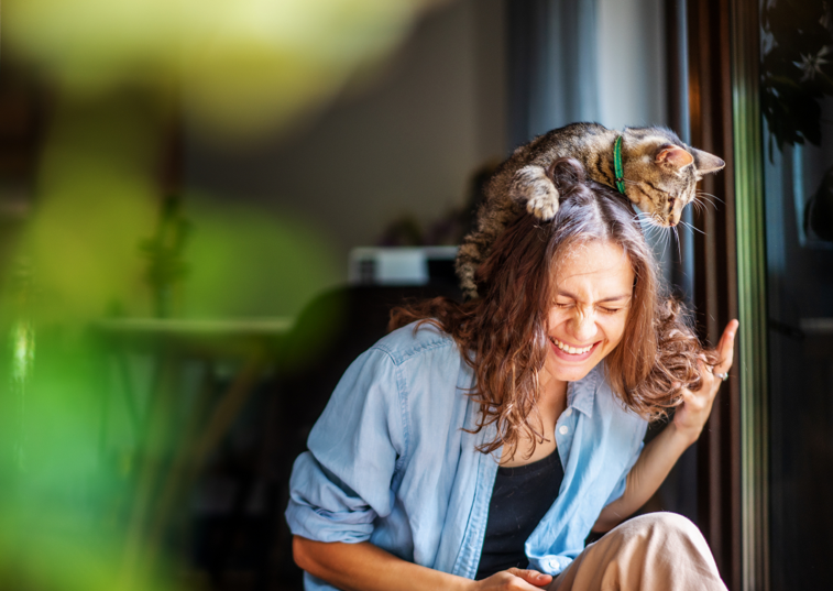 a cat sat on a womans head